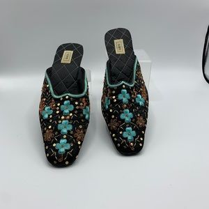 Toss embroidered mules.
